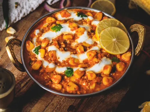 Bowl of yellow seeds in a spicy sauce.