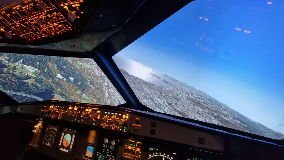 Airplane cockpit turning with landscape view.