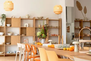 Dining area with wooden furniture and decor.
