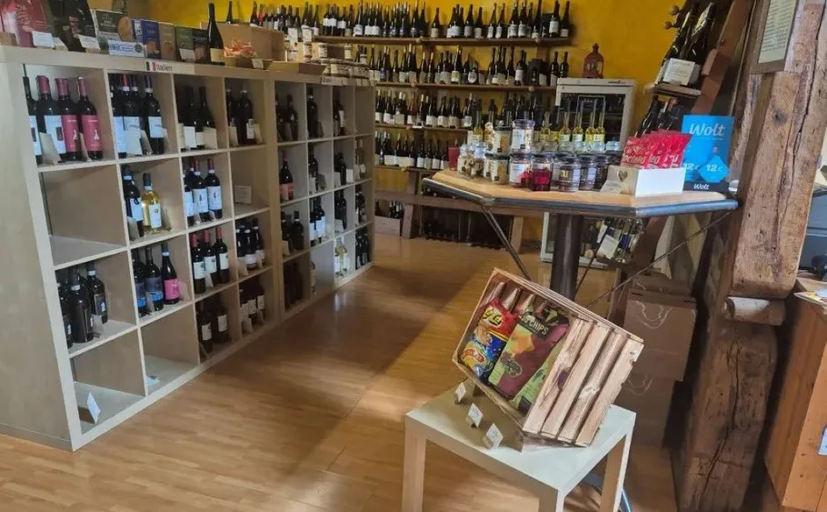 Shelves with wine bottles in a shop.