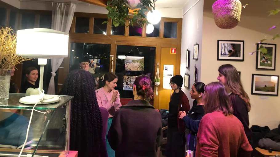 Group of people talking in a cozy room.