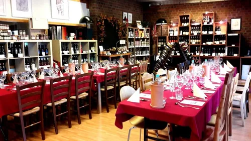 Restaurant tables set with wine glasses.