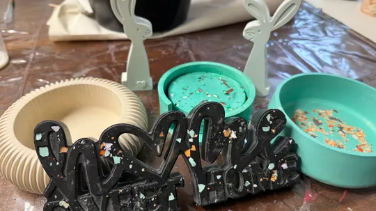 Decorative objects and molds on a table.