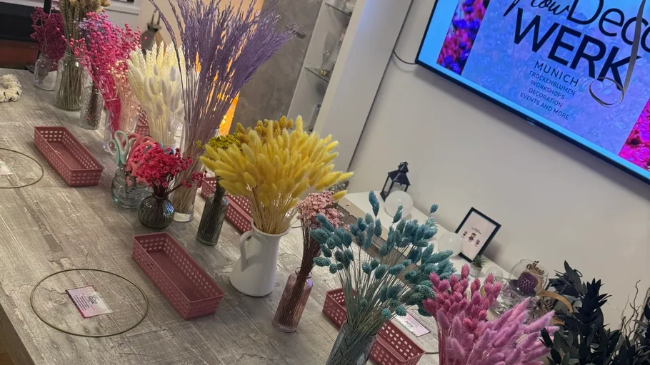 Colorful dried flowers on wooden table.