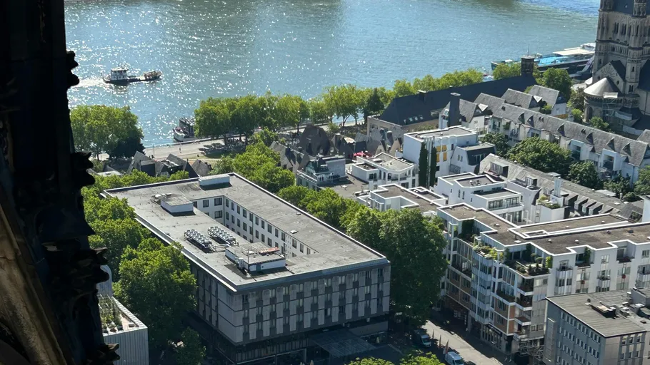 Aerial view of buildings by a river.