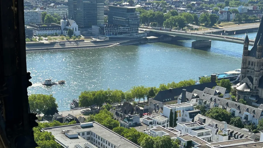 River view with cityscape and bridge.