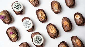 Assorted chocolates on white surface.