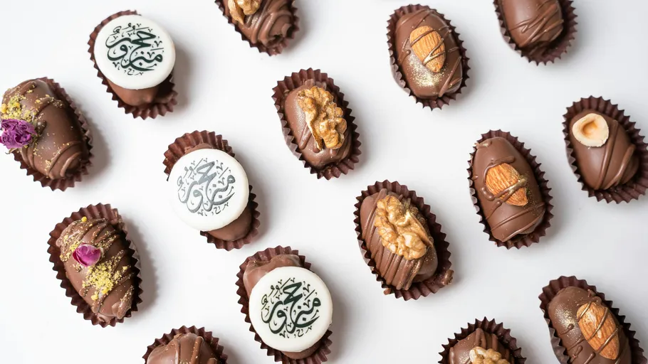 Assorted chocolates on white surface.