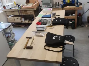 Wooden table with tools, ready to be used in the workshop