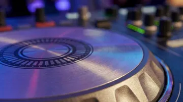 Close-up of DJ mixer at a club.