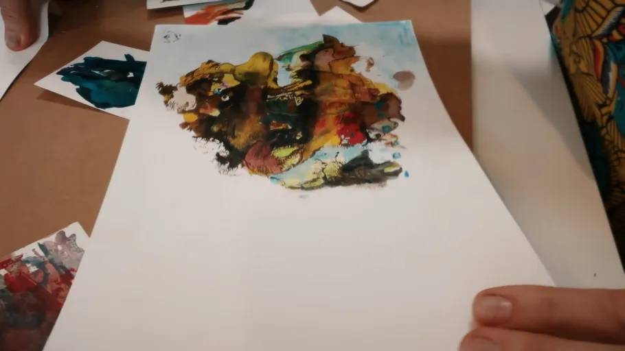 Colorful abstract painting on white paper.