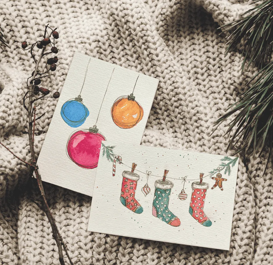 Christmas cards on a knitted blanket.