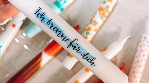 Decorated candles on a table.