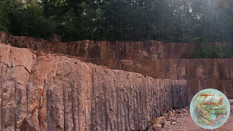 Rock quarry with vertical stone formations.