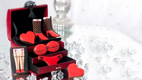 Red and black themed cookies on a table.