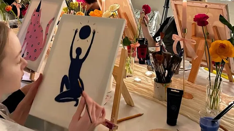 Person painting silhouette at art class.