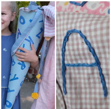 Child holding decorated cone; close-up of letter A.