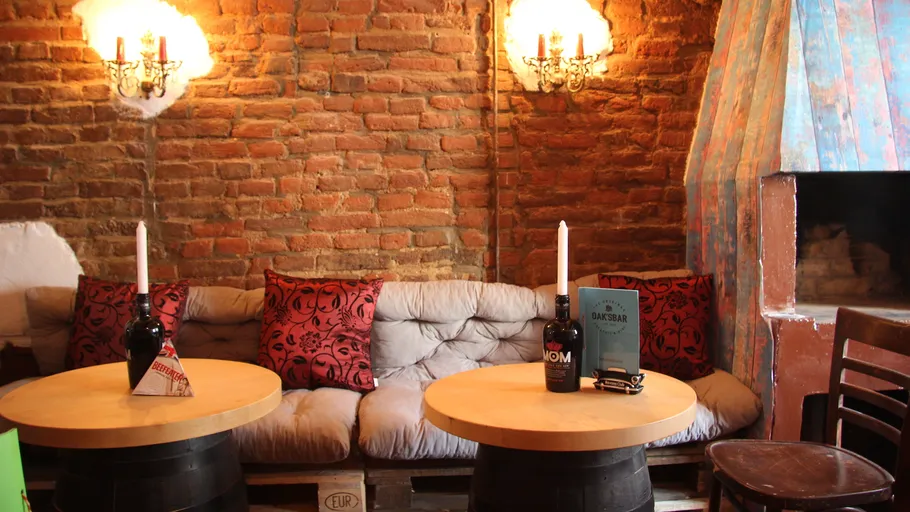 Cozy lounge with brick walls and candles.