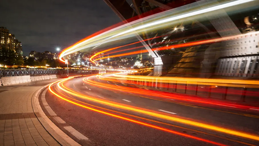 Light trails on busy city road at night.