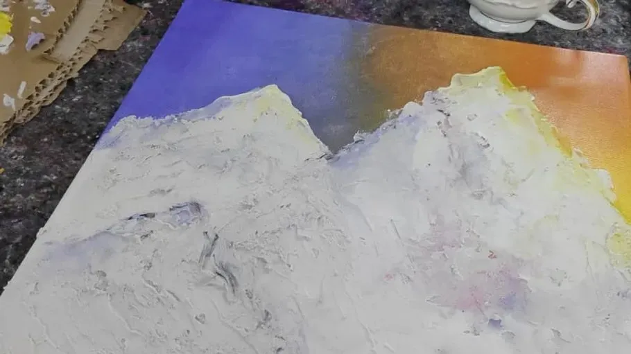 Abstract mountain painting on textured surface.