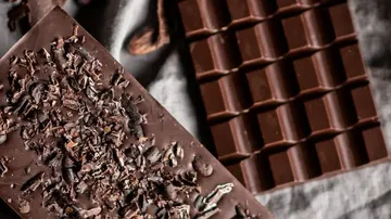 Chocolate bars on a cloth background.