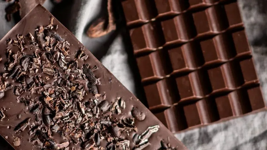 Chocolate bars on a cloth background.