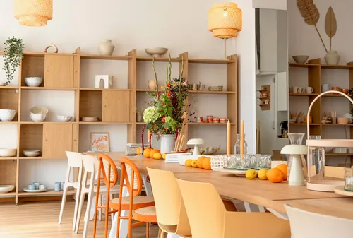 Modern dining area with wooden furniture.