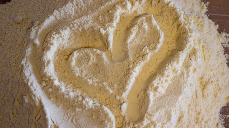 Heart drawn in flour on countertop.