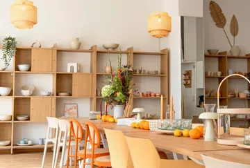 Dining room with wooden furniture and decorations.