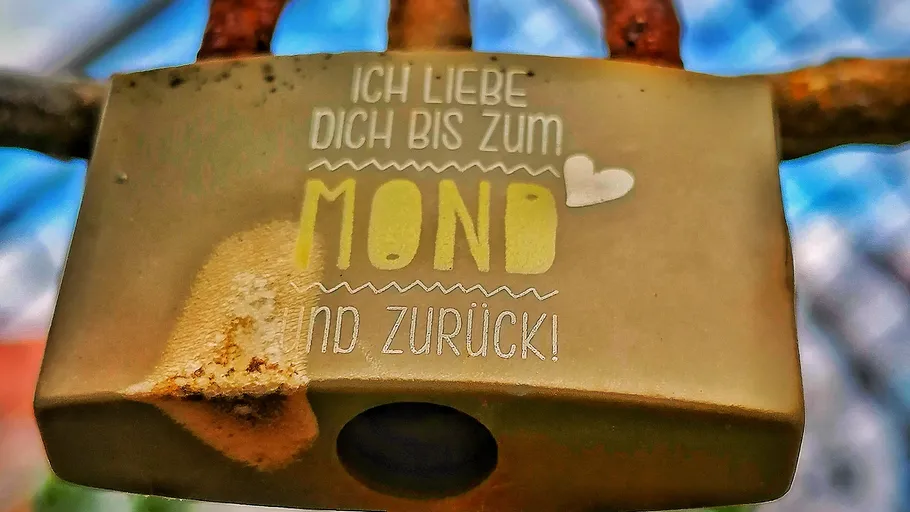 Rusty padlock with love message engraved.