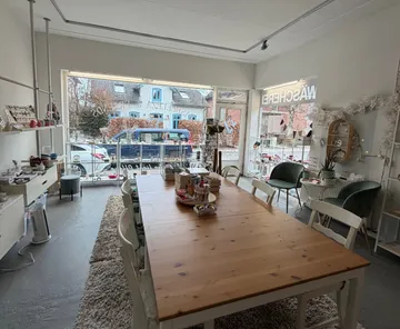Craft studio with large table, window view.