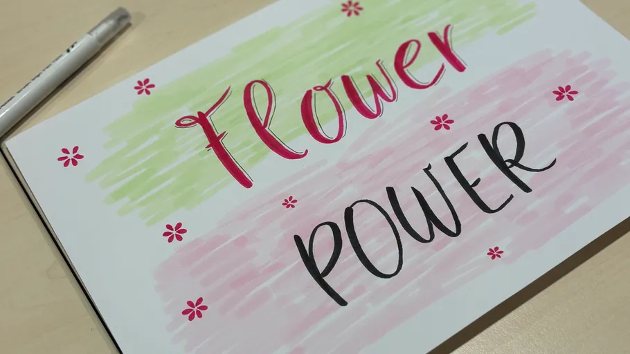 Colorful text 'Flower Power' on table.