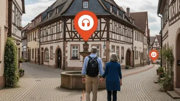 Couple walks through quaint German village.