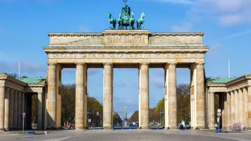 Brandenburg Gate in sunny Berlin street.