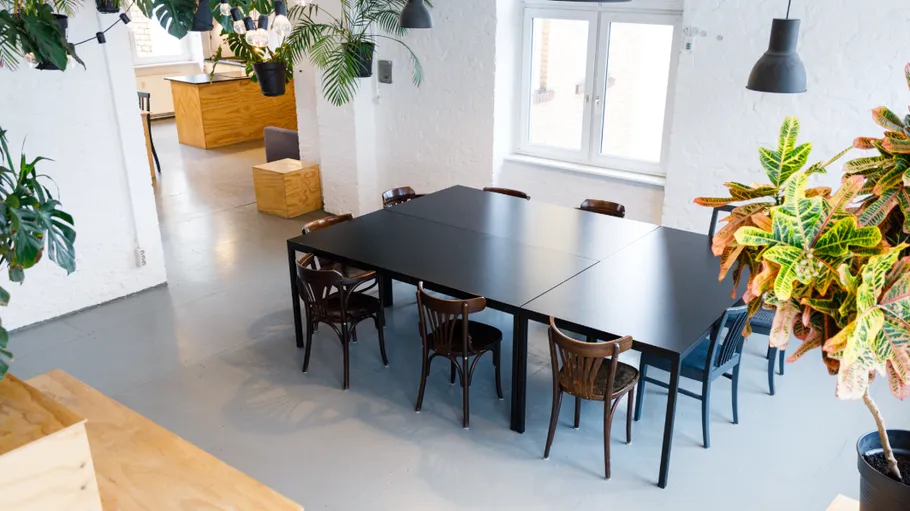 Black table with chairs in modern office.