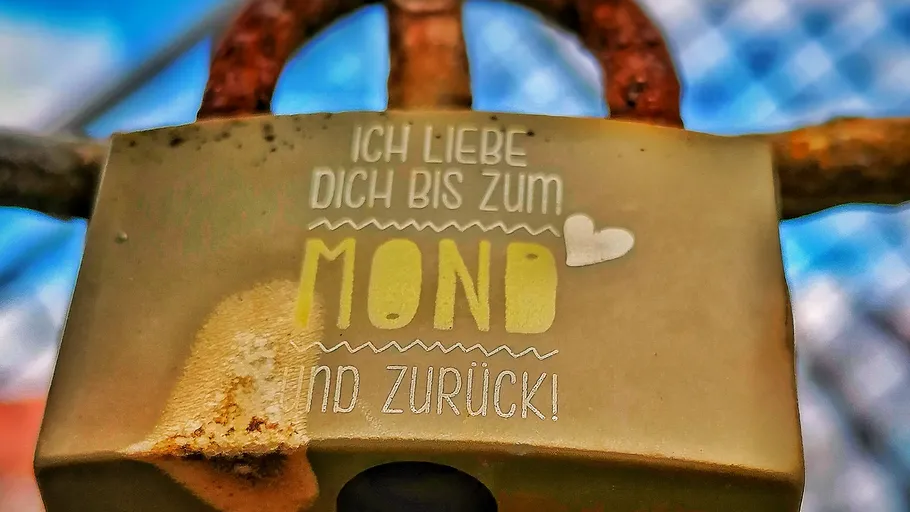 Lock with love message on bridge.