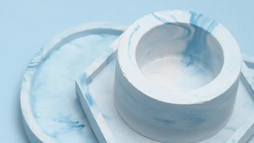 Blue and white marbled bowl on plate.
