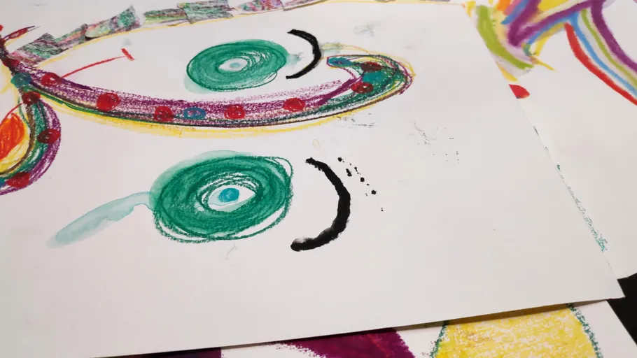 Colorful abstract drawings on paper sheets.