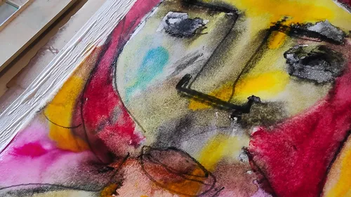 Abstract face painting with vivid colors.