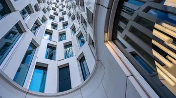 Modern building facade with reflective windows.