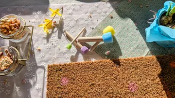 Colorful mini-golf setup with snacks and decor.