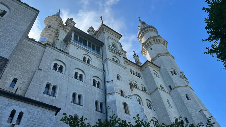 White castle towers against a blue sky.