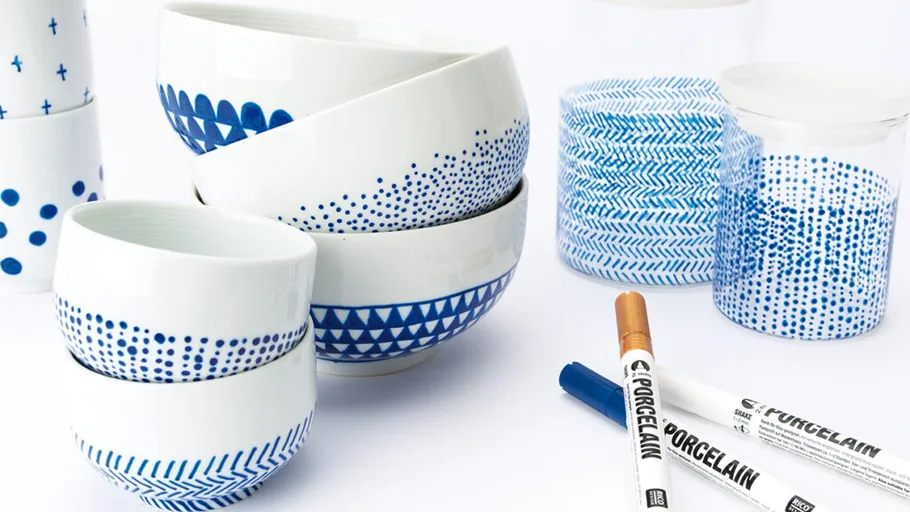 White bowls with blue patterns, porcelain markers nearby.