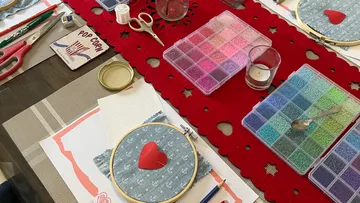 Crafting materials arranged on a table.