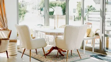 Cozy dining area with large windows.
