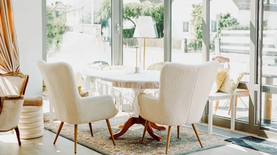 Cozy dining area with large windows.