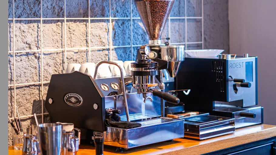 Espresso machine on a wooden counter.