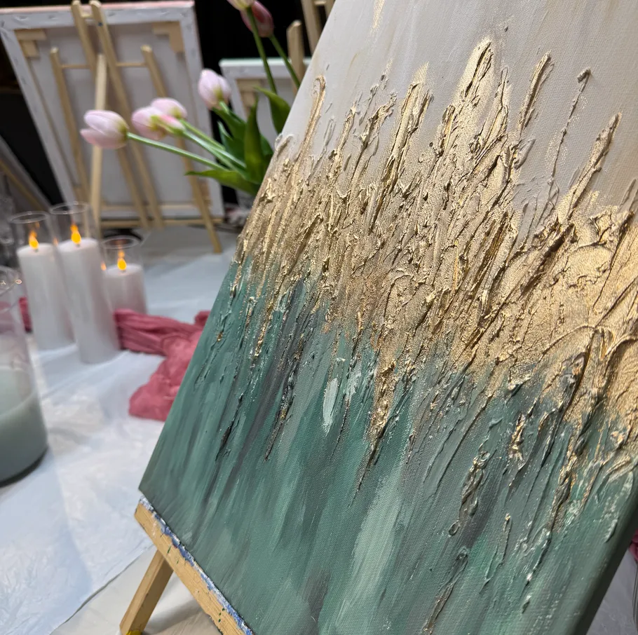 Textured painting with candles and tulips nearby.