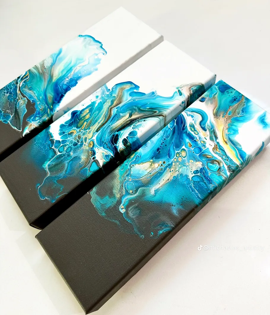 Three abstract paintings with blue and white swirls.