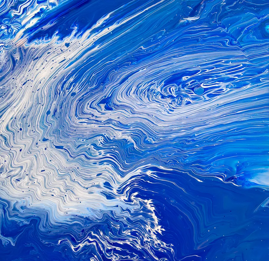 Abstract blue and white swirling paint pattern.